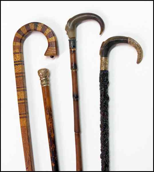 Appraisal: FOUR WALKING STICKS Two with horn cane handles one of