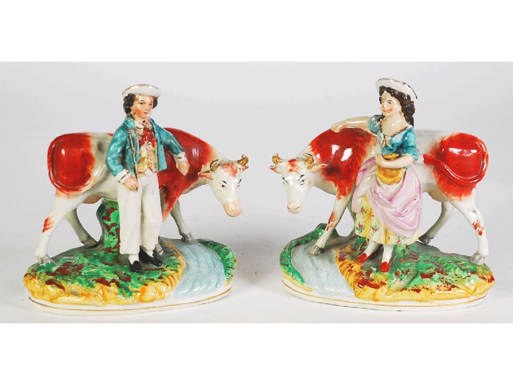 Appraisal: PAIR OF NINETEENTH CENTURY STAFFORDSHIRE POTTERY GROUPS painted in colours