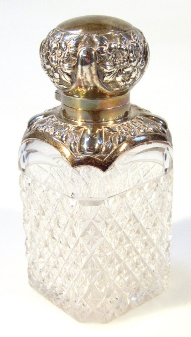 Appraisal: An early thC cut glass perfume bottle with white metal