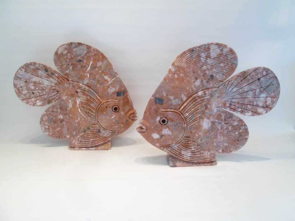 Appraisal: TWO LARGE CARVED STONE FISH with black painted eyes Fish