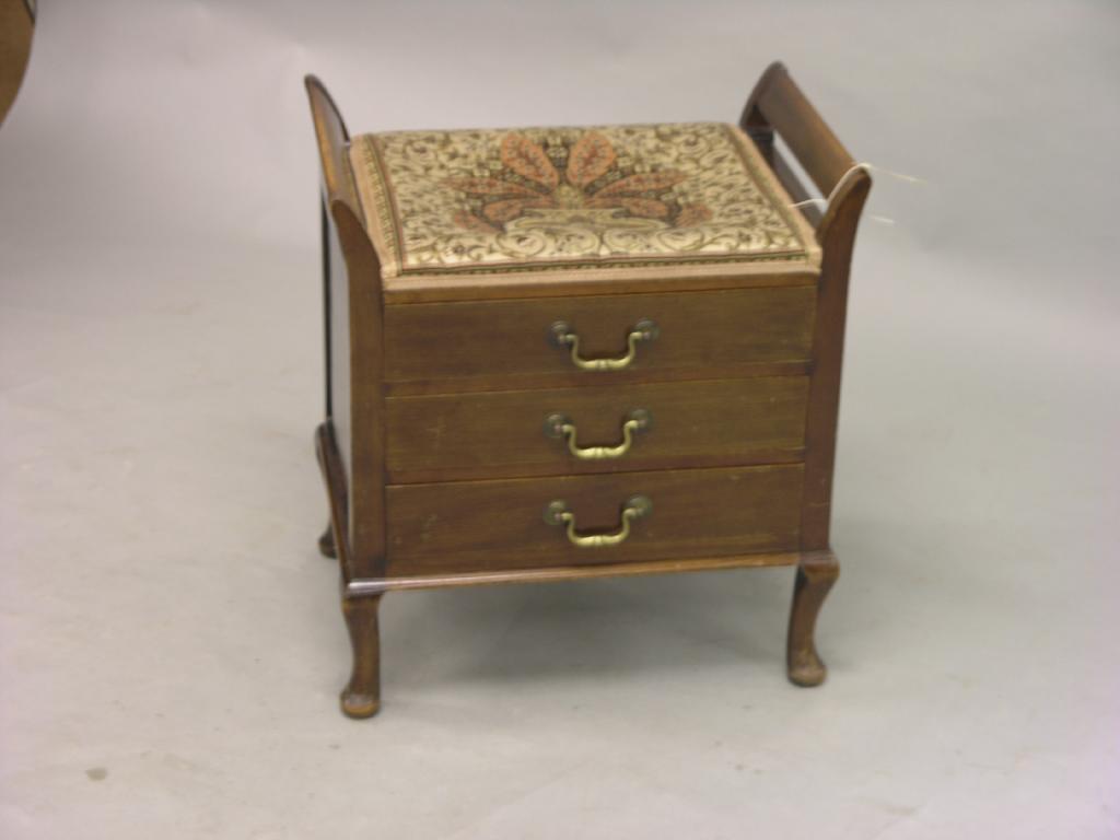 Appraisal: An Edwardian mahogany piano stool upholstered seat above three sheet