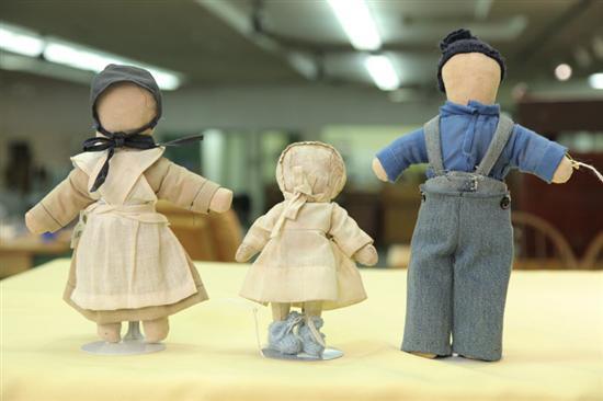 Appraisal: THREE AMISH MADE DOLLS Two cloth one leather A boy