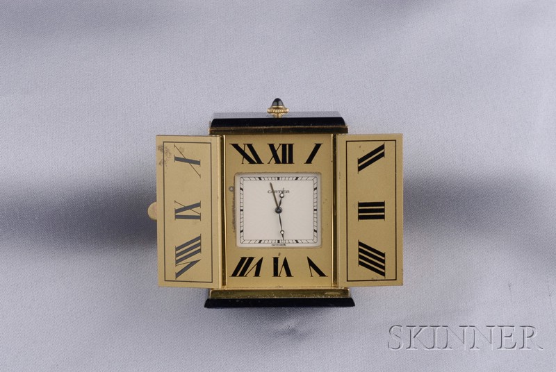 Appraisal: Onyx Travel Clock Must de Cartier the gilt-metal sunburst-incised case