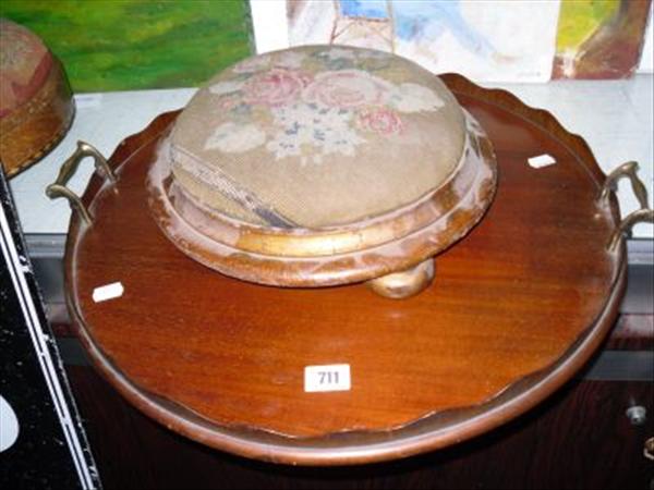 Appraisal: A circular walnut galleried serving tray and a Victorian embroidered