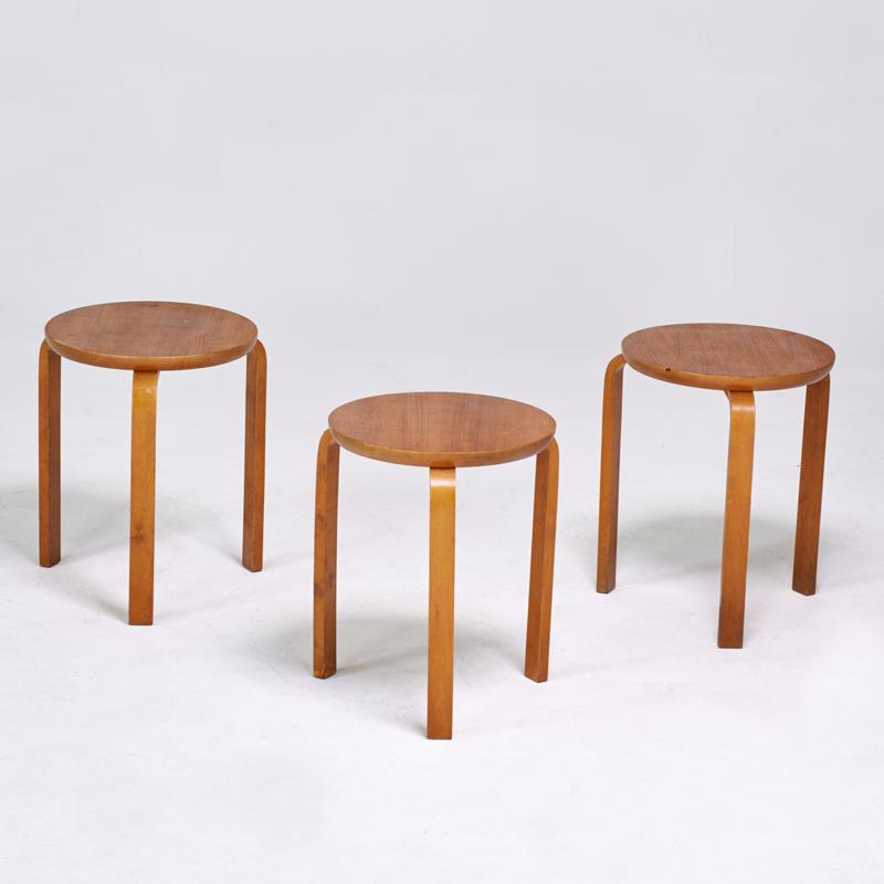 Appraisal: STYLE OF ALVAR AALTO Three stacking stools Sweden s Teak