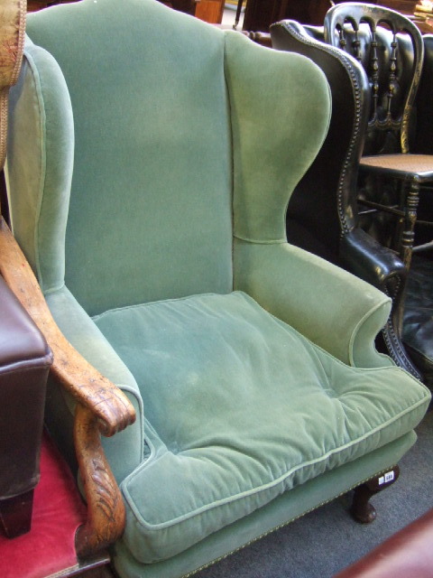 Appraisal: An early th century style wing back armchair the hump