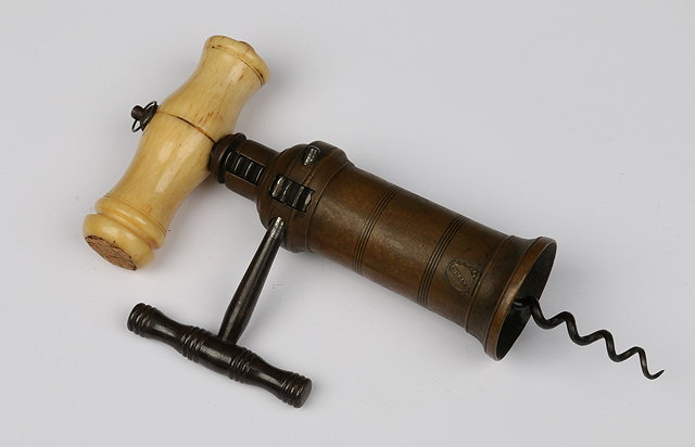 Appraisal: A BRASS BARRELLED LONDON RACK CORKSCREW with a turned ivory