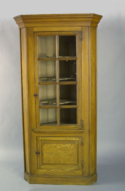 Appraisal: Pennsylvania painted one piece corner cupboard th c retaining an