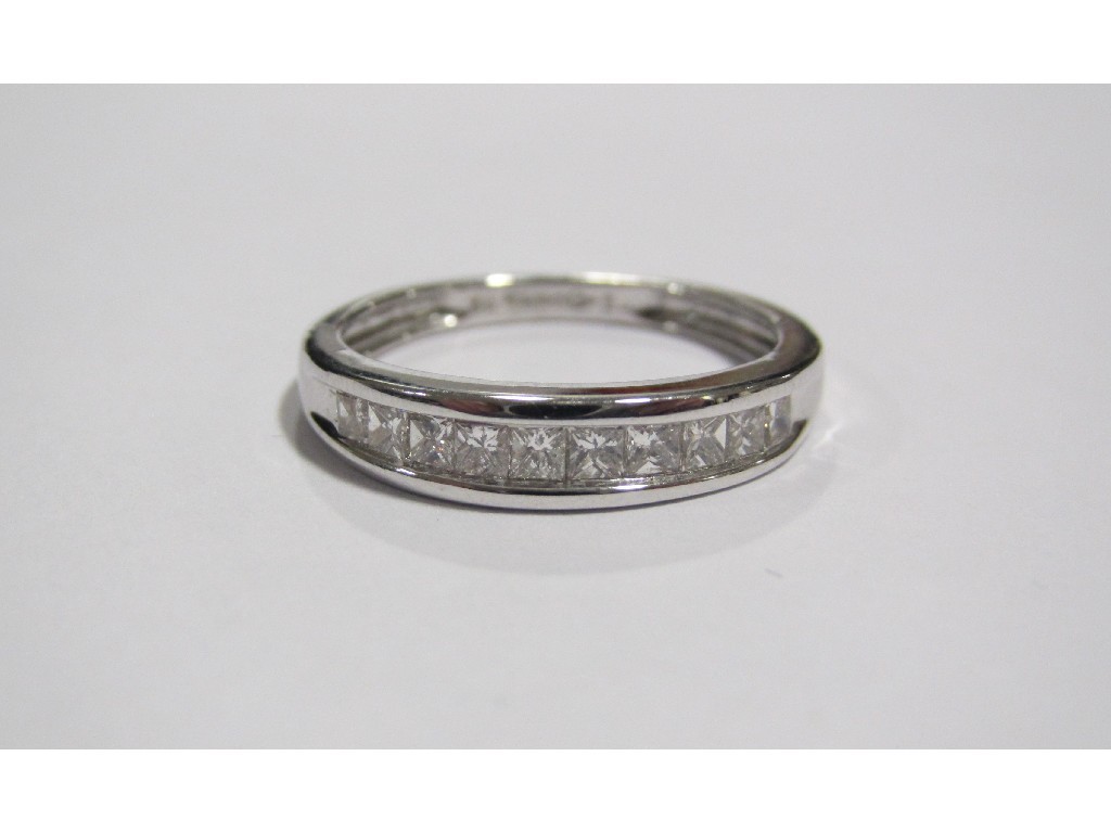 Appraisal: An eighteen carat white gold diamond half hoop ring with