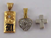 Appraisal: A white metal tests carat gold cross set with a