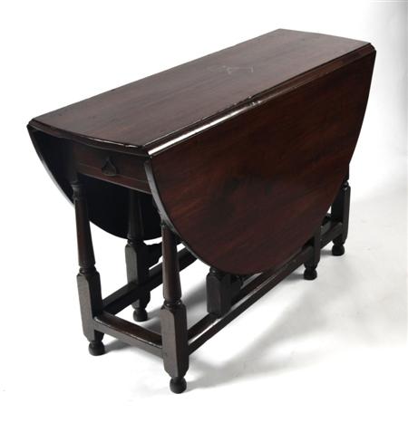 Appraisal: A th century style oak gate leg table the oval