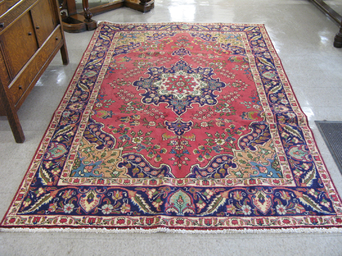 Appraisal: PERSIAN TABRIZ CARPET floral and central floral medallion design on