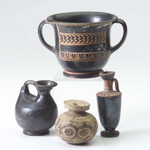 Appraisal: Four earthenware vessels all with remains of polychrome decoration tallest