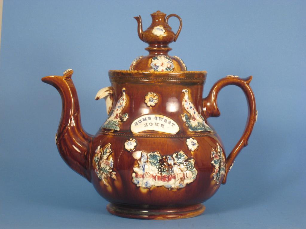 Appraisal: A Victorian large Barge ware Teapot with applied birds and