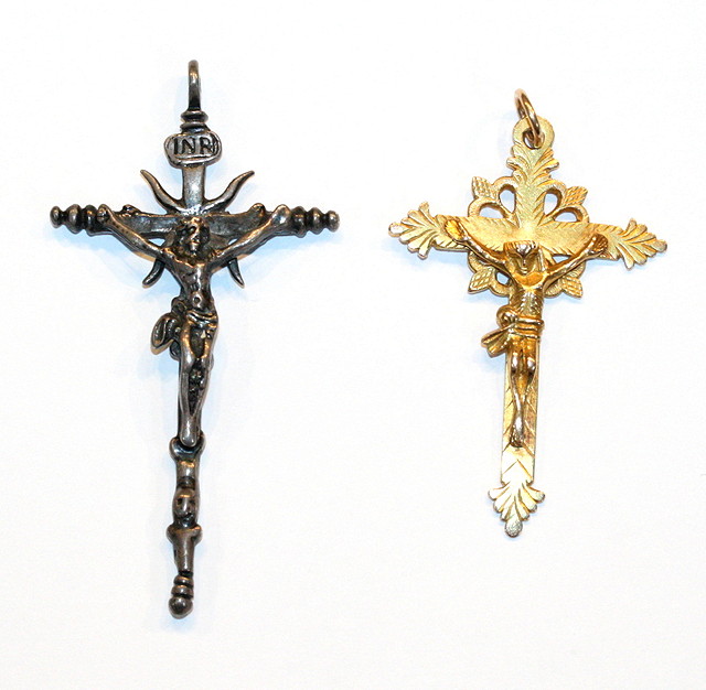 Appraisal: A SILVER CRUCIFIX and a further crucifix