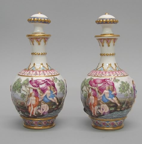 Appraisal: Featuring figural scenes on both bottles matched pair with stoppers