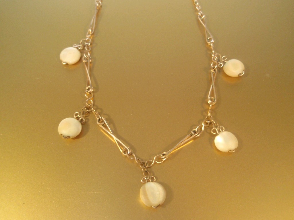 Appraisal: A Victorian bar link necklace with mother of pearl drops