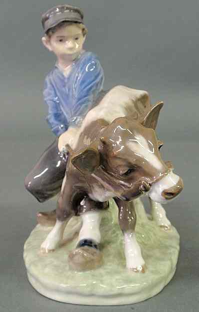 Appraisal: Royal Copenhagen figural group of a young farm boy with