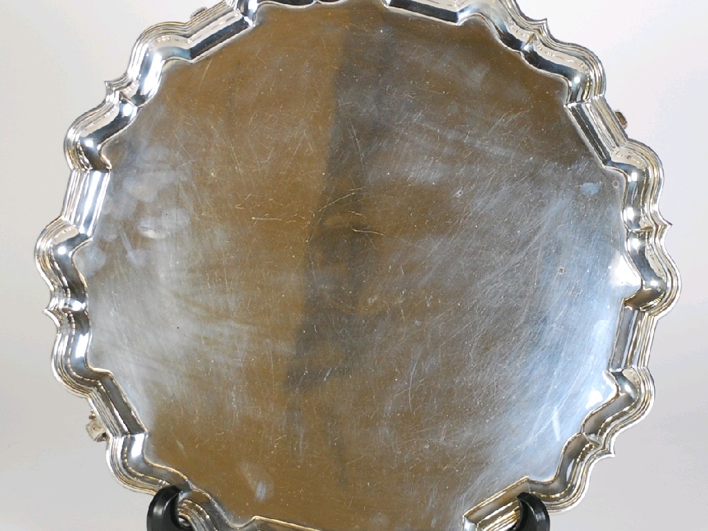 Appraisal: SILVER SALVER with Chippendale style shaped and moulded border raised