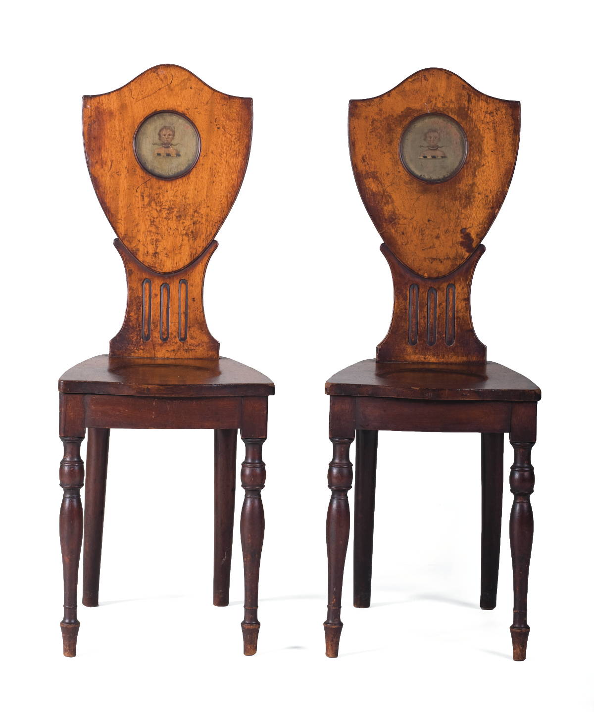 Appraisal: PAIR OF GEORGIAN CARVED AND PAINTED MAHOGANY HALL CHAIRS Each