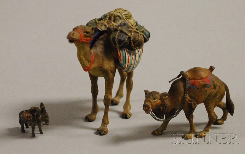 Appraisal: Three Miniature Cold-painted Bronze Figures two camels and a pack