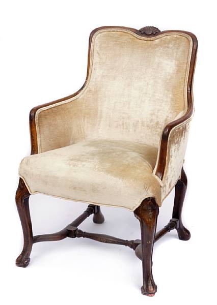 Appraisal: An Italian carved walnut and upholstered armchair height in width