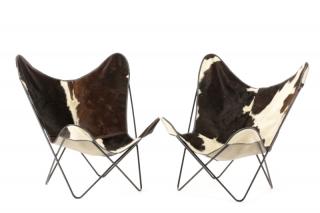 Appraisal: Pair Wrought Iron and Cow Hide Butterfly Chairs American last