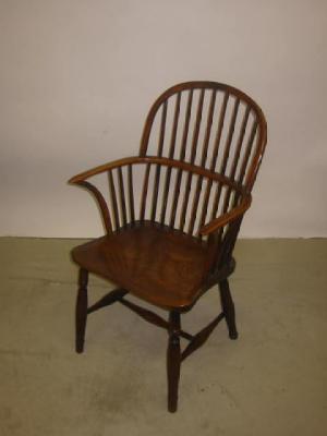 Appraisal: A YEW WINDSOR ARM CHAIR of hooped stick back form