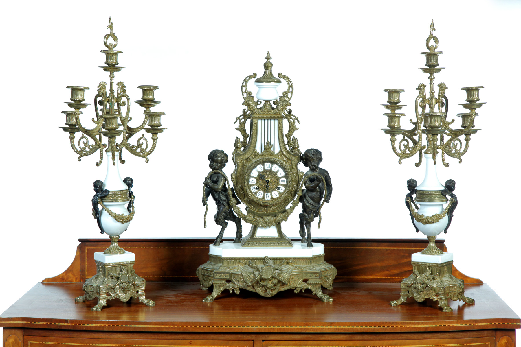 Appraisal: BAROQUE-STYLE MANTEL CLOCK SET Germany th quarter- th century Brass