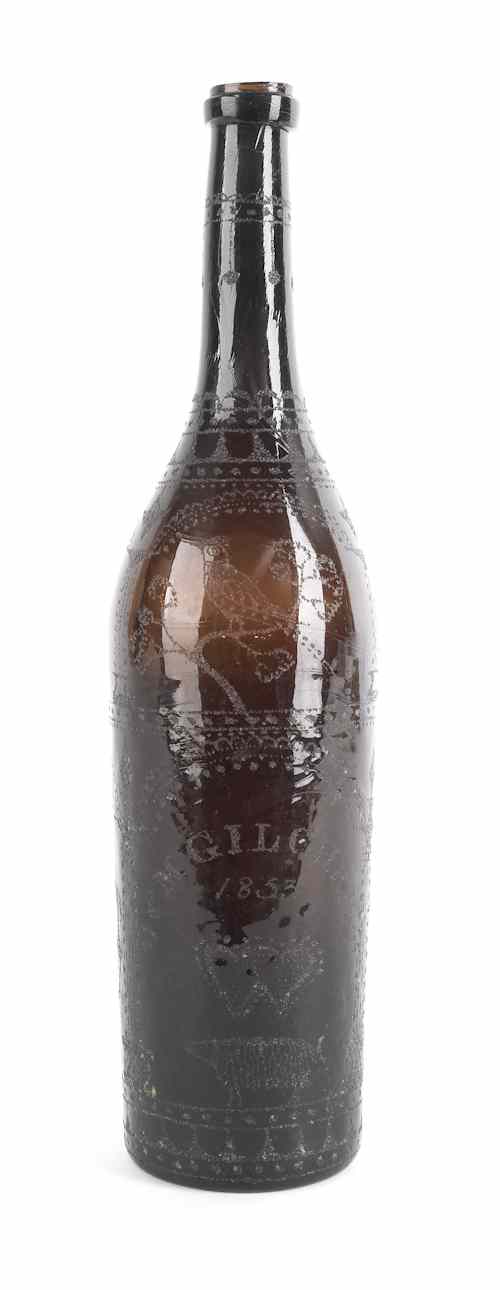 Appraisal: Etched amber glass wine bottle dated inscribed J M Gilchrist