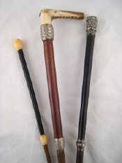 Appraisal: Three riding crops or whips one with traditional antler handle