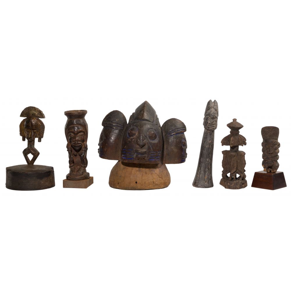 Appraisal: AFRICAN CARVED WOOD FIGURINE ASSORTMENT items of varying sizes including