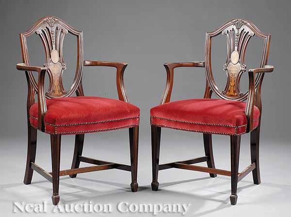 Appraisal: A Pair of Antique Hepplewhite-Style Inlaid Mahogany Chairs molded shield