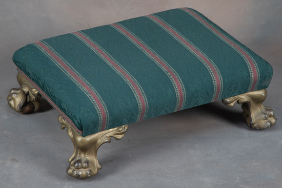 Appraisal: Antique Foot Stool with ornate iron feet holding wooden balls