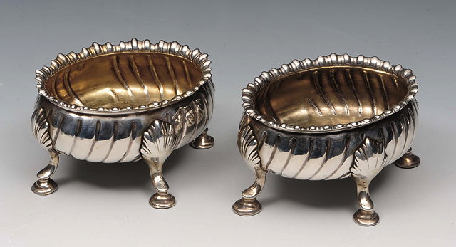 Appraisal: TWO GEORGE III SILVER SALT CELLARS oval shaped with fluted