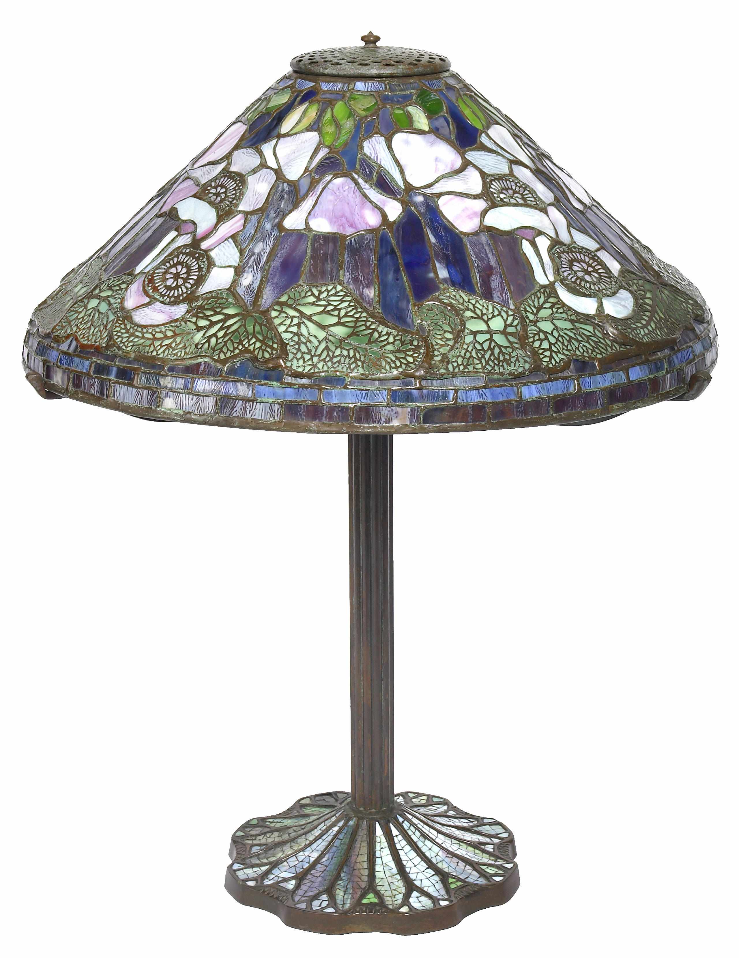 Appraisal: A leaded glass and patinated bronze table lamp height in