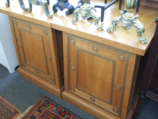 Appraisal: A pair of brass mounted oak pedestal cupboards late th