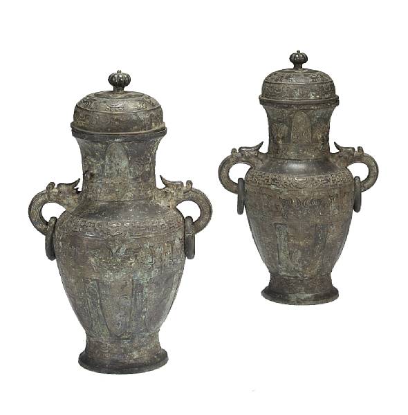 Appraisal: A pair of bronze archaistic covered vases Late Qing Republic