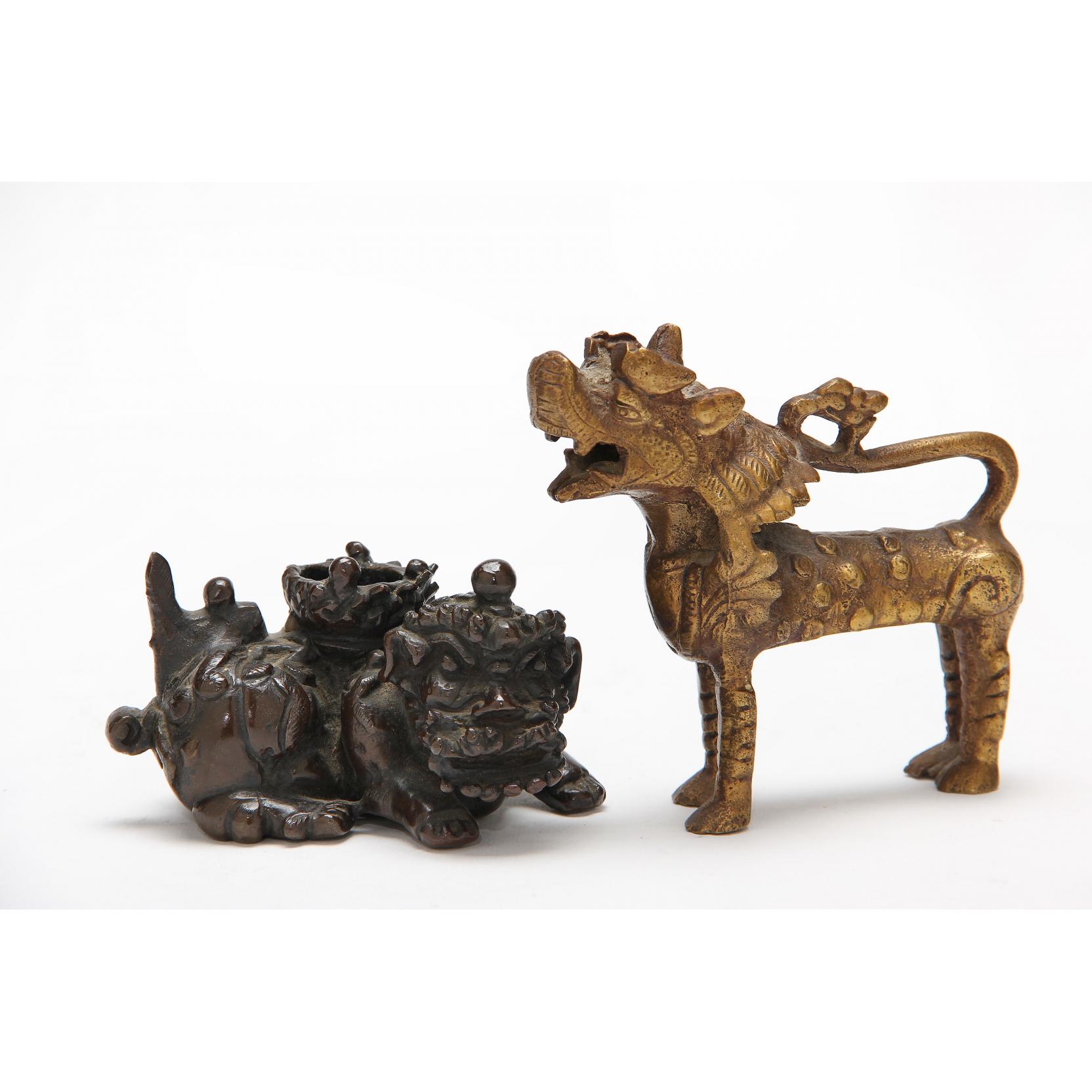 Appraisal: Two Bronze Foo Dogs the first th century patinated bronze