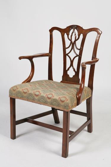 Appraisal: A GEORGE III CHIPPENDALE STYLE MAHOGANY ARMCHAIR with a scrolling