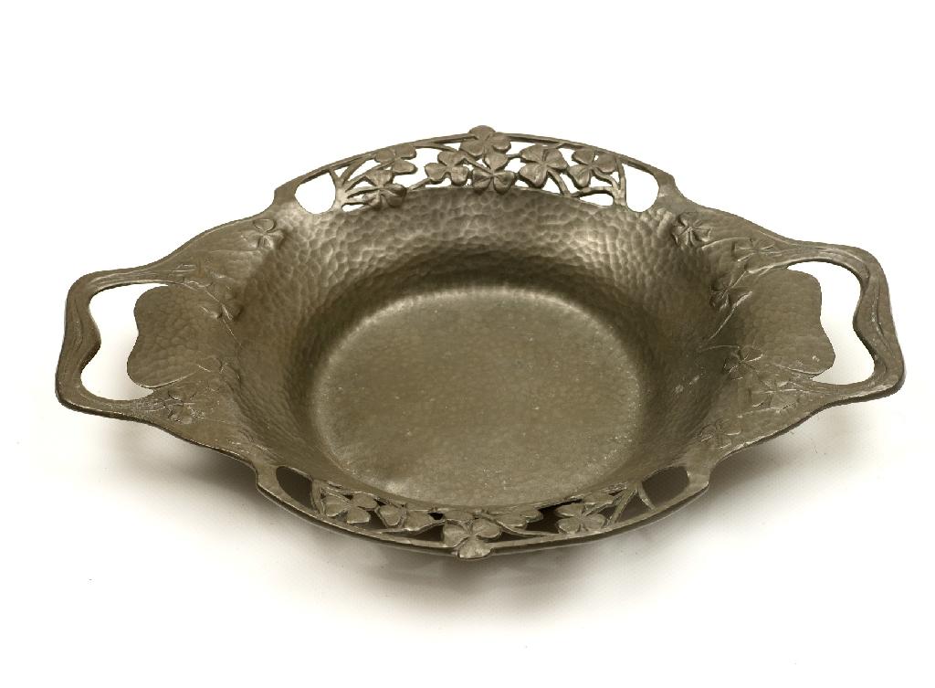 Appraisal: LIBERTY CO TUDRIC PEWTER TWO-HANDLED DISH with pierced shamrock borders