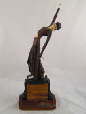 Appraisal: An Art Deco bronze figure with well detailed inset face