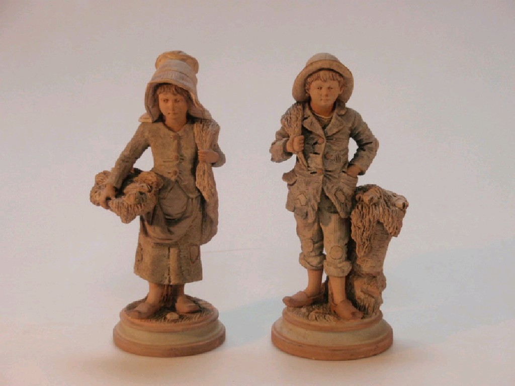 Appraisal: A pair of thC Austrian painted terracotta figures of a