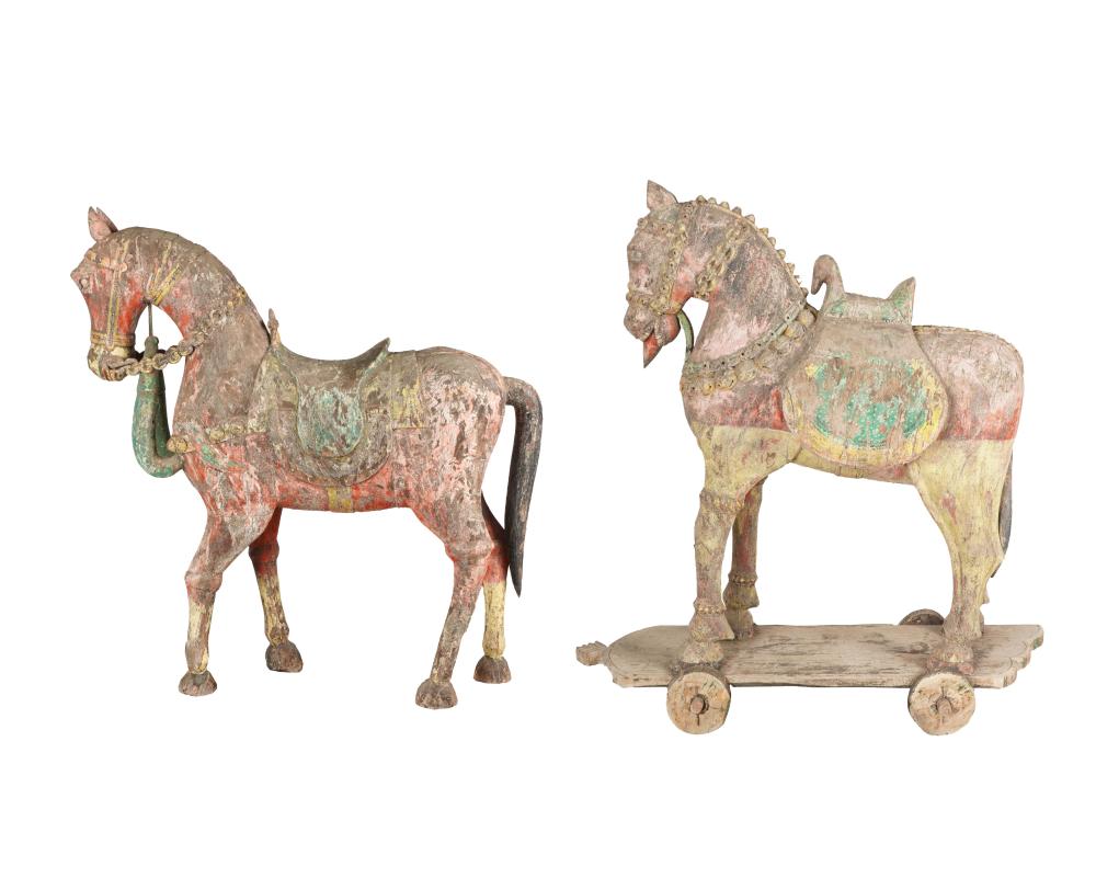 Appraisal: PAIR OF CARVED PAINTED HORSESeach on a rolling base Condition