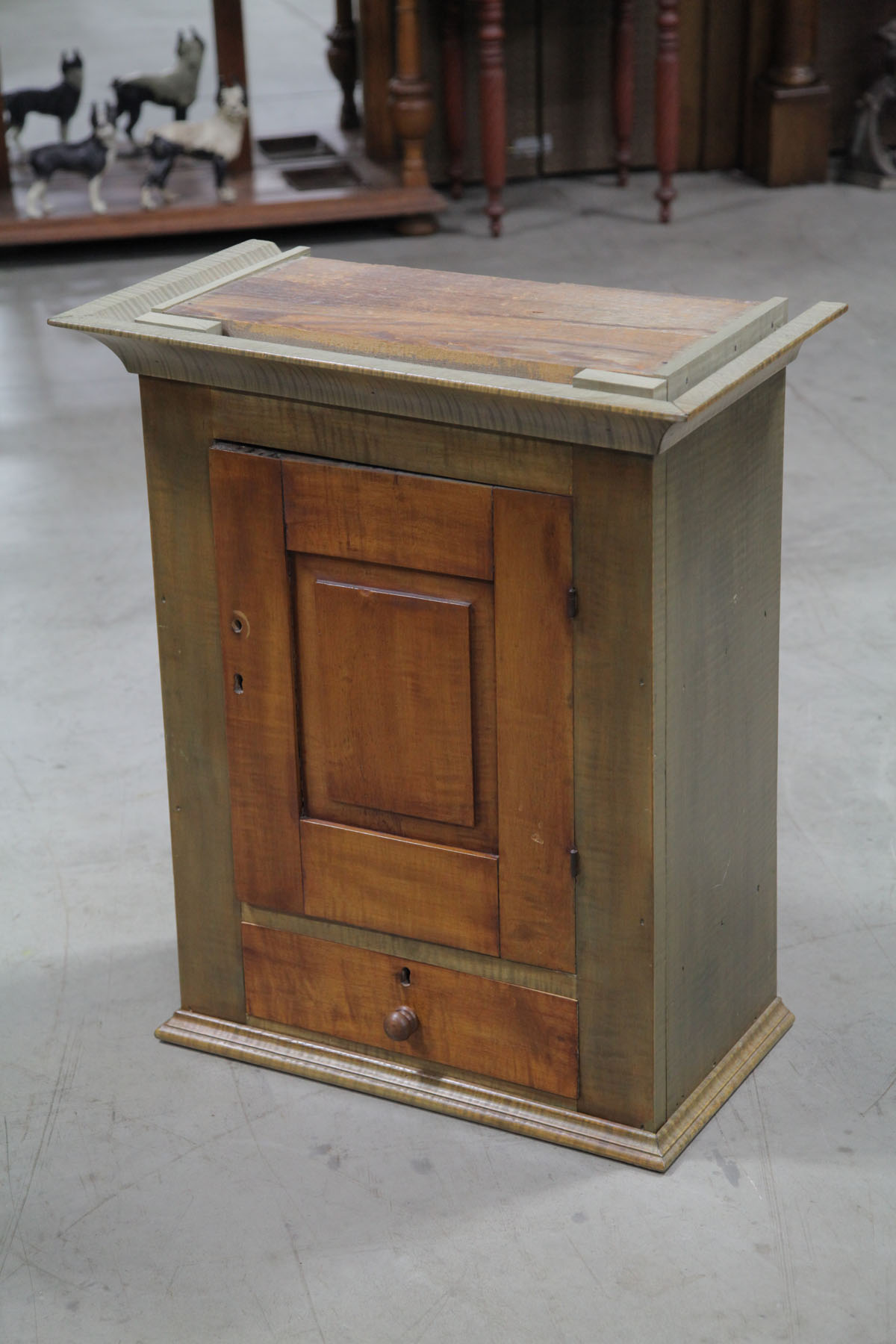 Appraisal: HANGING CUPBOARD American th century Maple and curly maple cupboard