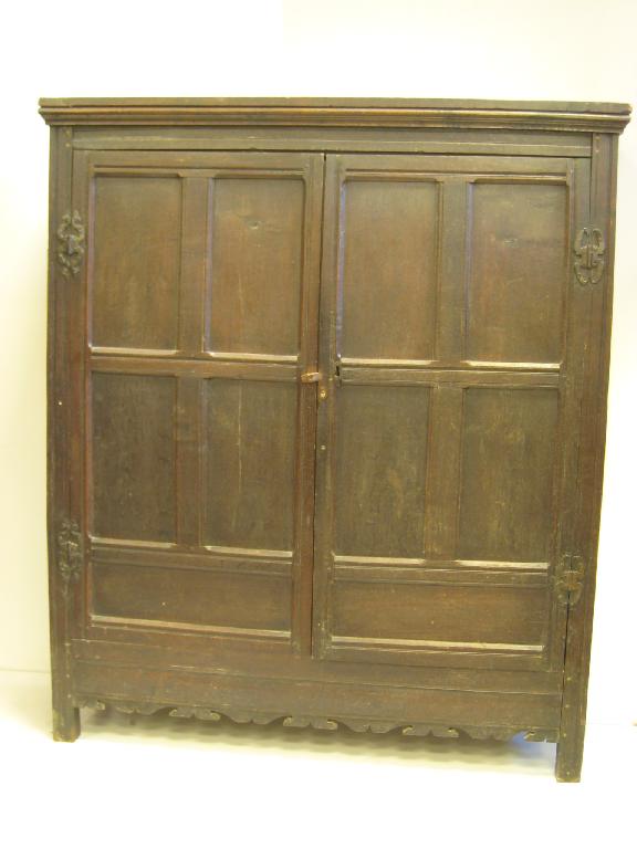 Appraisal: A th Century oak Cupboard the two panelled doors above