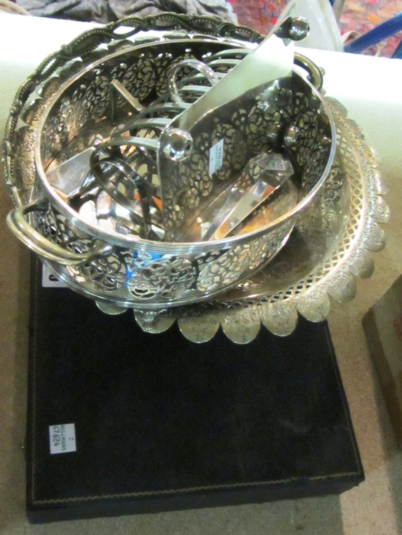 Appraisal: A group of silver plated wares comprising two toastracks an