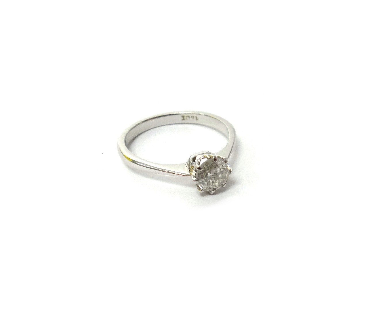 Appraisal: A white gold and diamond set single stone ring claw