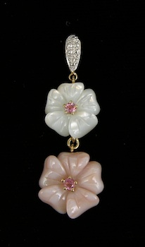 Appraisal: A Charming Carved Mother of Pearl Pendant This pendant features