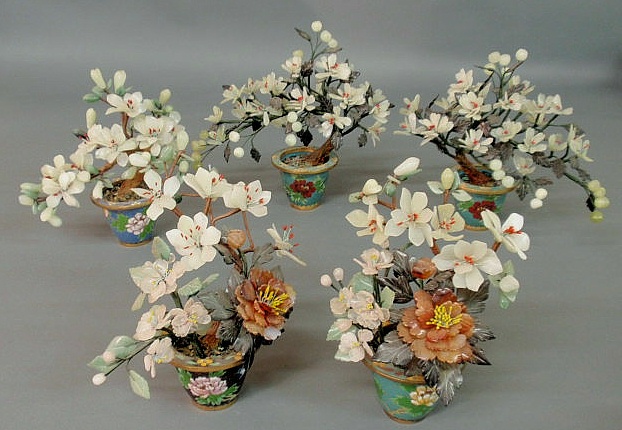 Appraisal: Five jade and stone flowering trees th c with cloisonn